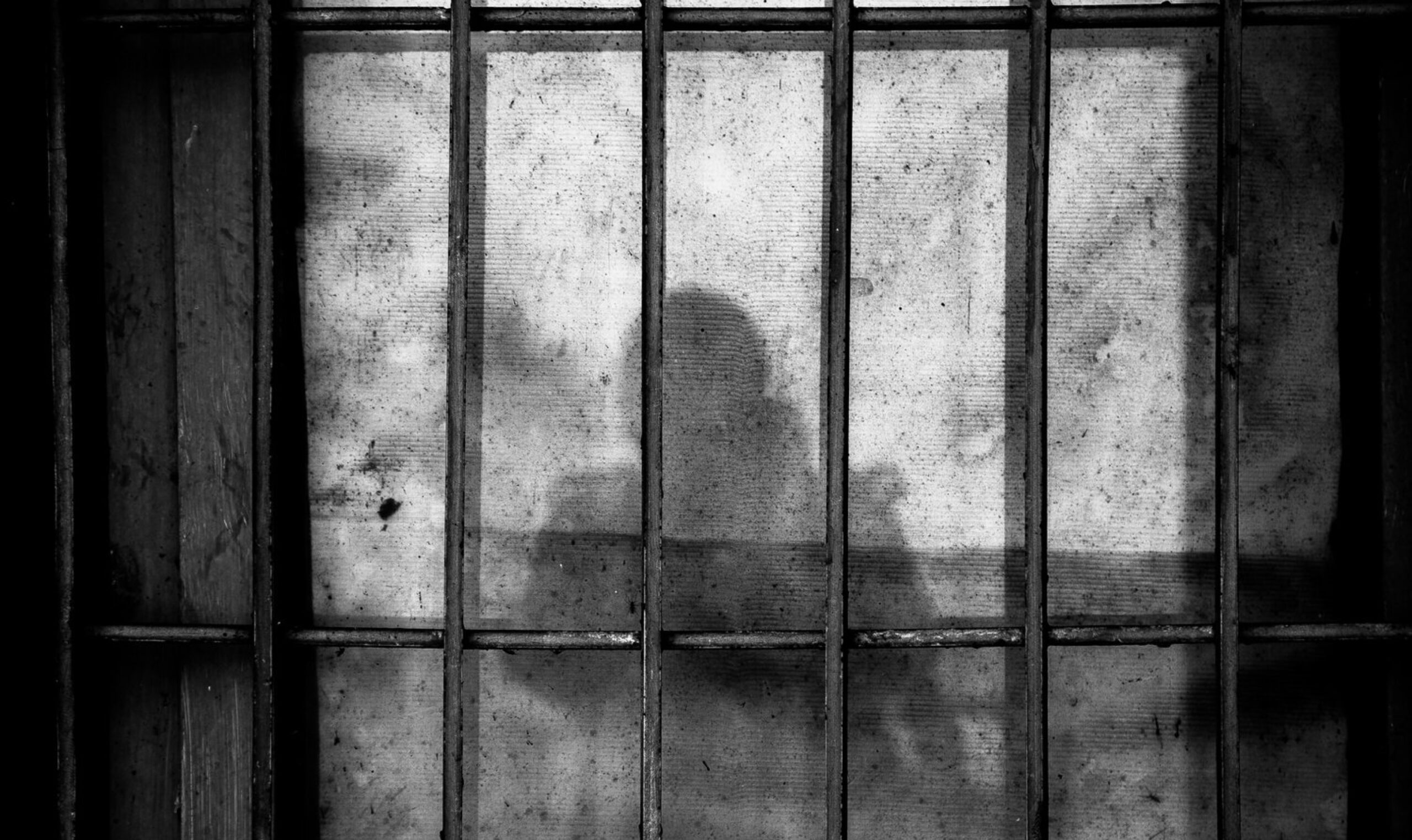 Person behind jail bars